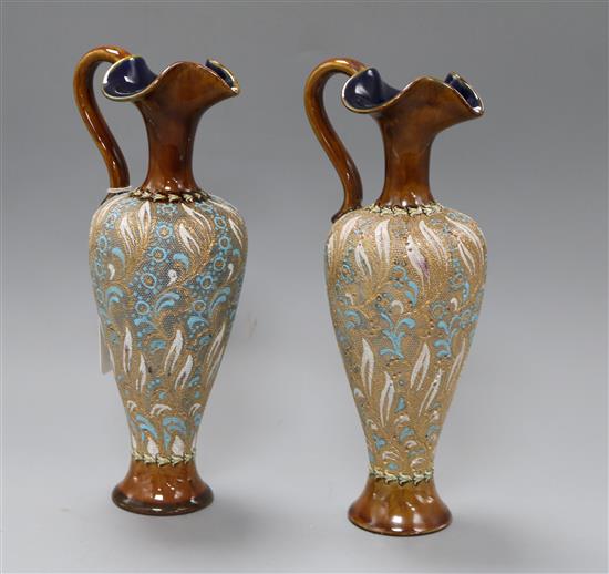 A pair of Doulton Slaters patent ewers height 27cm